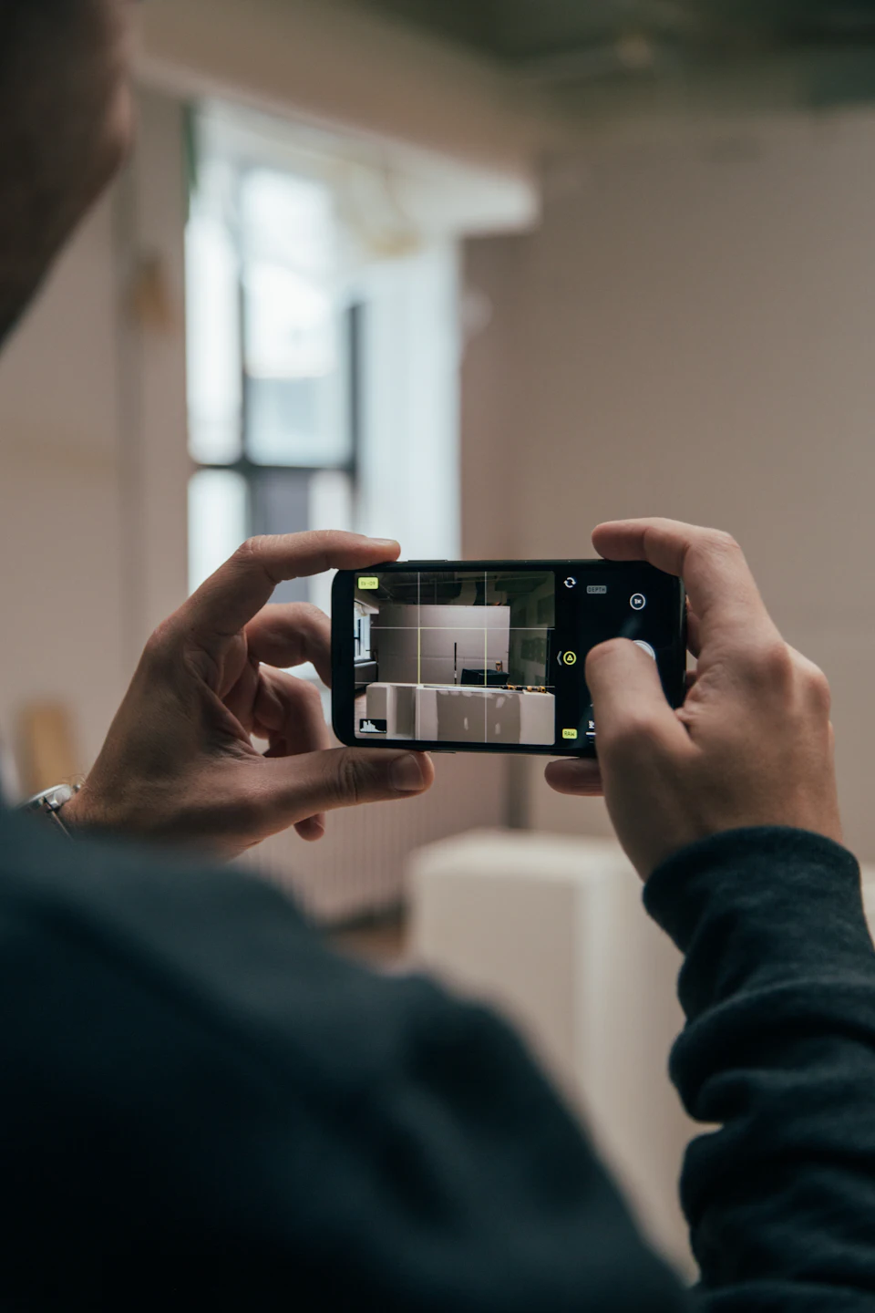 Person using smartphone and capturing images