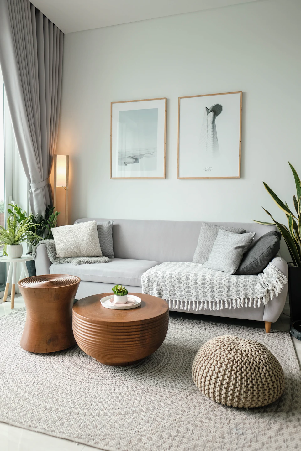 A living room filled with furniture and a large window