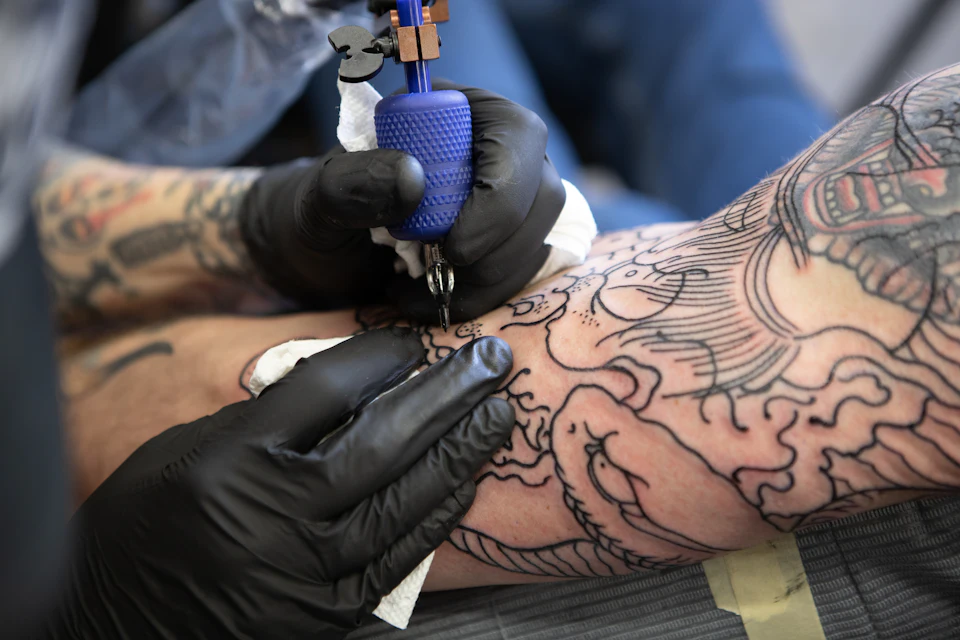 Person with tattoo on right arm
