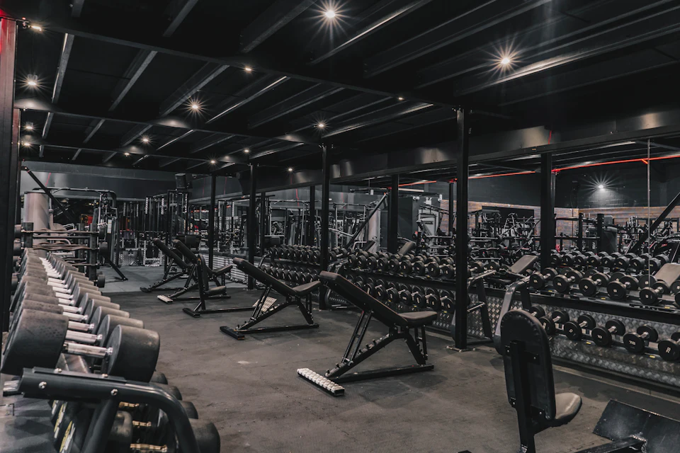 A gym filled with lots of machines and weights