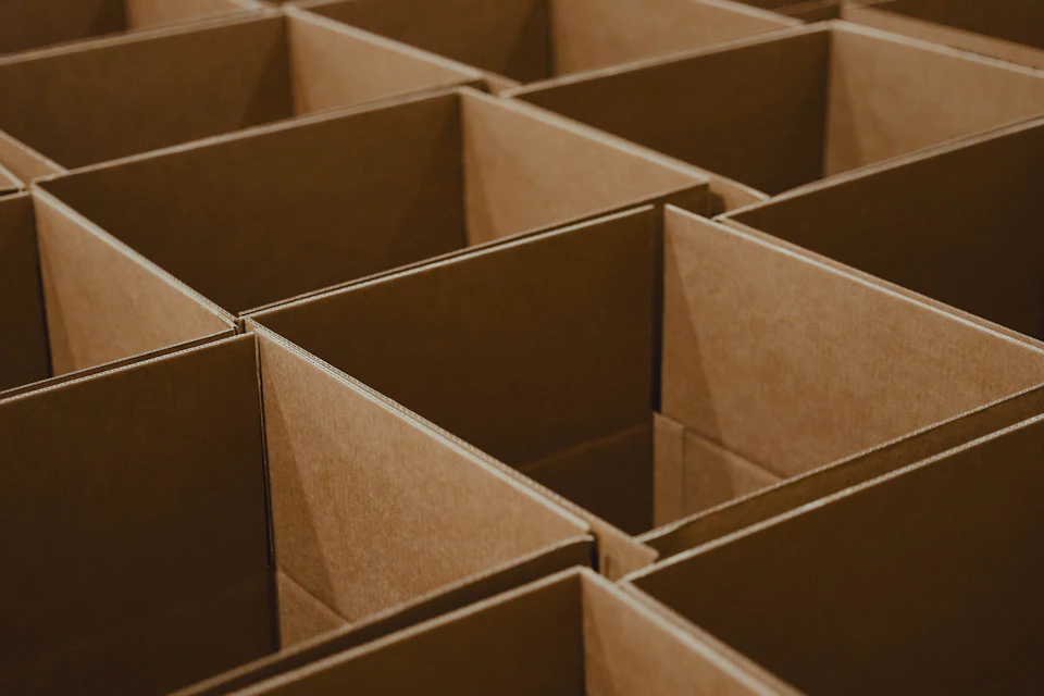 A lot of brown boxes that are open