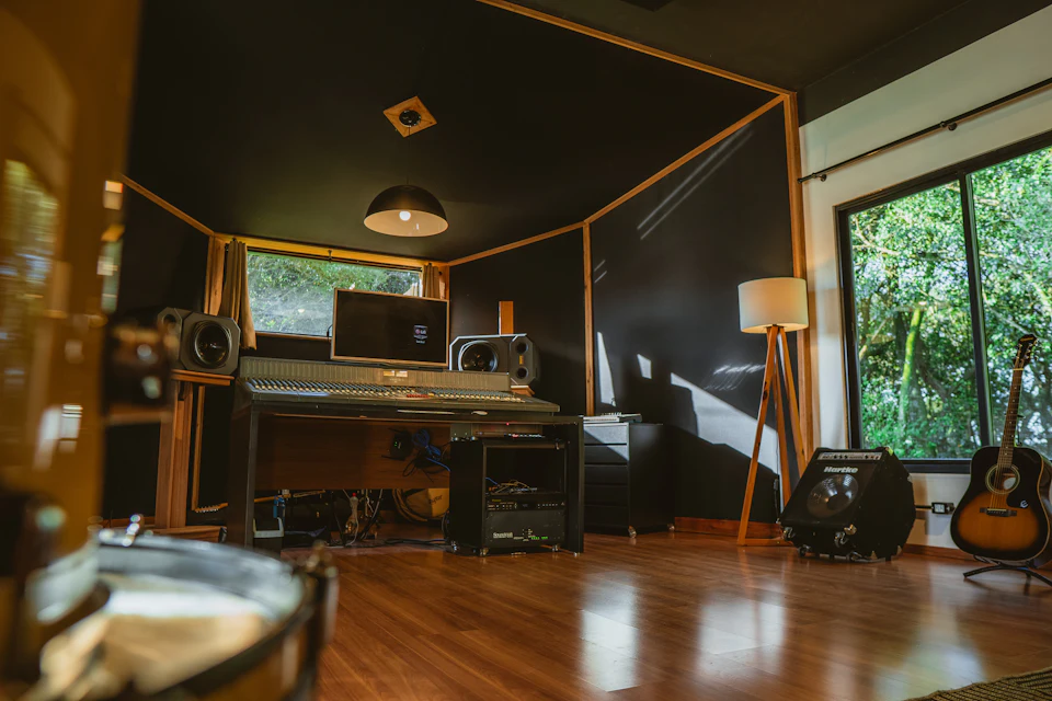 A recording studio with instruments and equipment