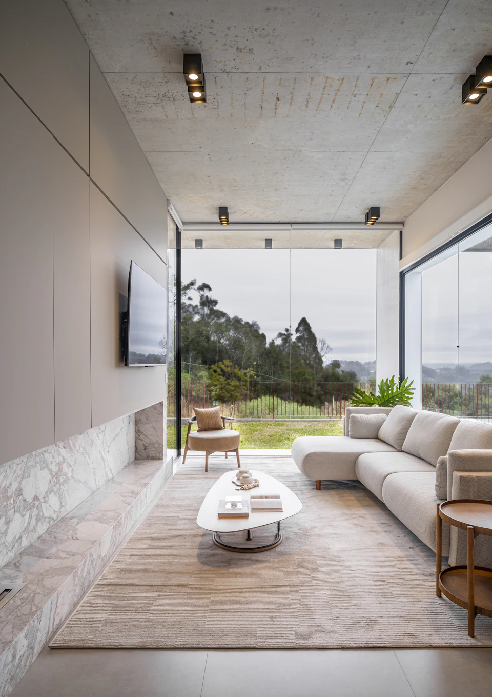 Modern living room with large windows and scenic view