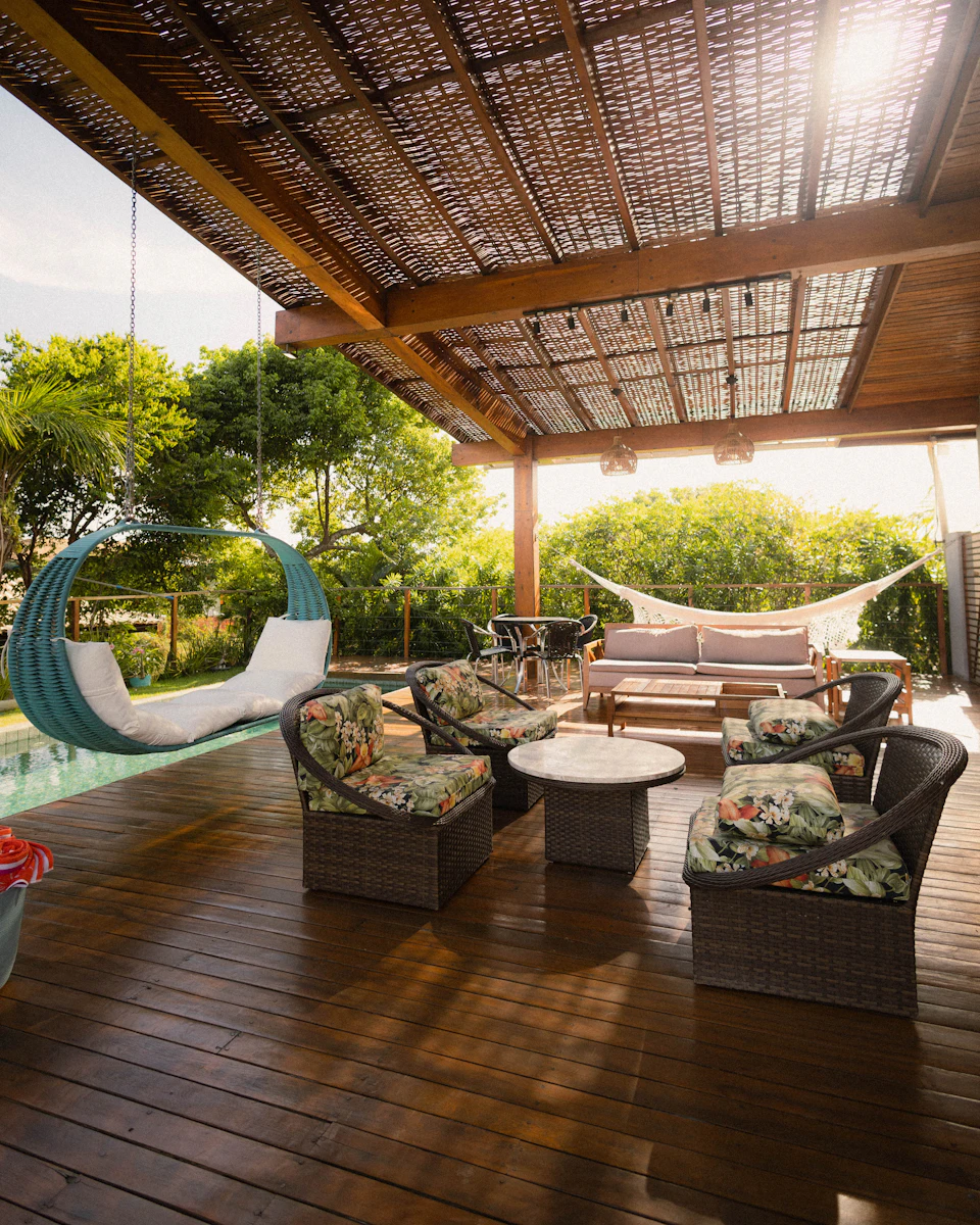 A beautiful patio with seating and a swing